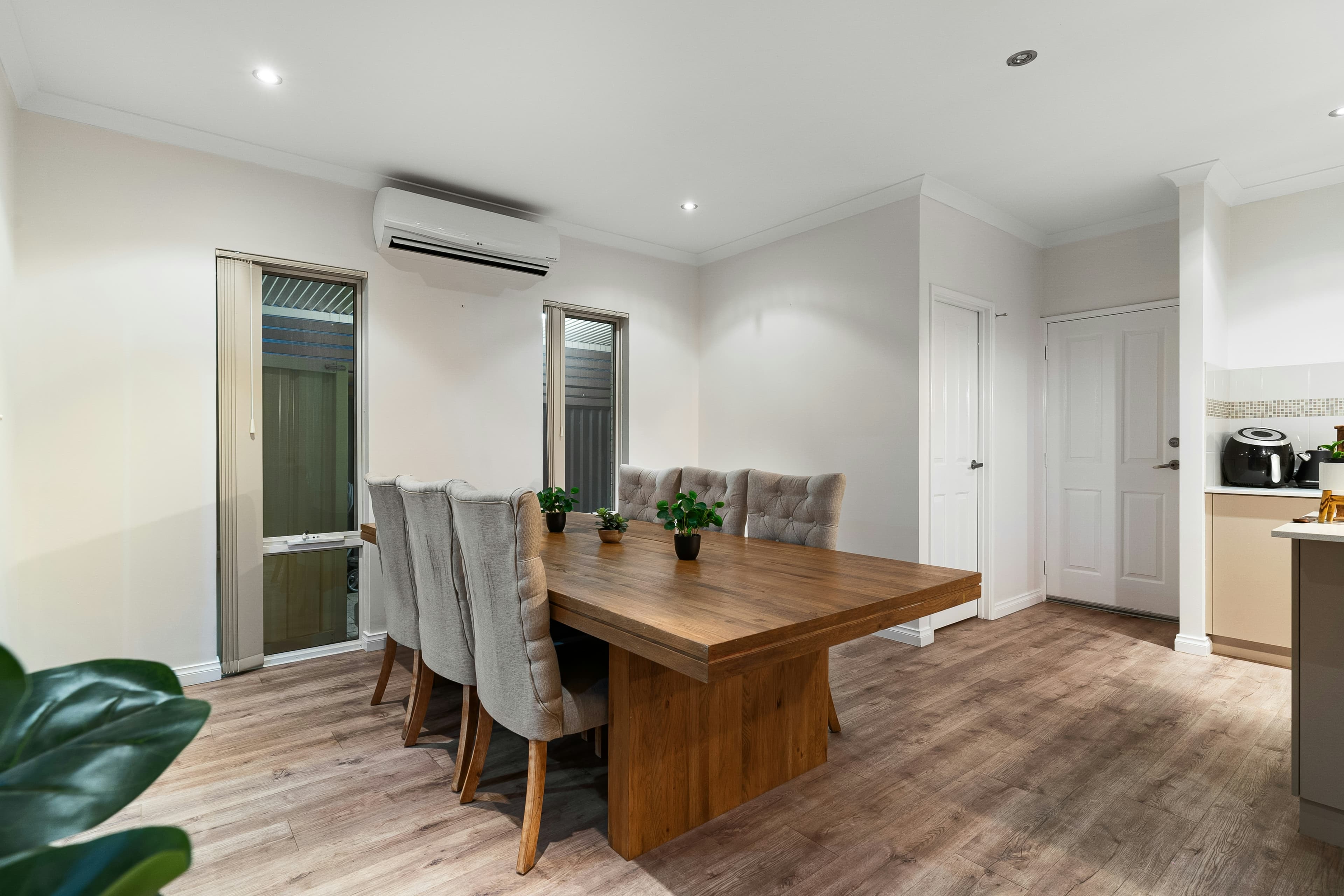 A bright room with newly installed hybrid flooring